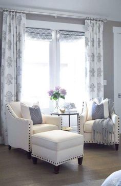 a living room filled with furniture and a flat screen tv