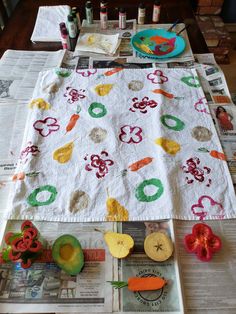 the table is covered with paper and fruit