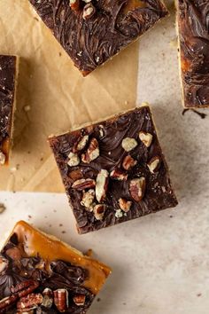 chocolate fudge bars with pecans and caramel on top