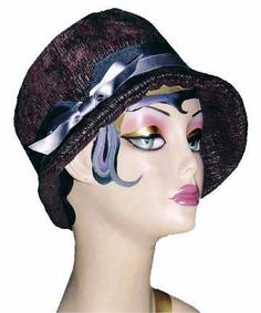 THE GRACE, handmade in Seattle, WA, USA, is a soft and flexible, 1920s style cloche hat. This hat is shown in Bongo Black/Gray Upholstery Fabric with assorted bands and trims. The brim is 2" at center front, flaring out to 2 3/4" at side front, and curving back to 3/4" at center back of hat. The crown is made of six panels. Prices are as shown. May be ordered without band for $79. These hats are custom made and all sales are final. Available in Medium 22-1/2 " and Large 23-1/2 " with custom sizi Winter Flapper Style Brimmed Cloche Hat, Fitted Flapper Cloche Hat With Brim, Adjustable Wide Brim Flapper Hat, Fitted Flapper Cloche Hat, Adjustable Cloche Hat In Flapper Style, Adjustable Cloche Flapper Hat, Flapper Style Short Brim Cloche Hat For Kentucky Derby, Flapper-style Brimmed Cloche Hat For Party, Flapper Style Brimmed Cloche Hat For Parties