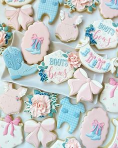 baby shower cookies are arranged on a table