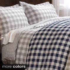 a bed with blue and white checkered sheets