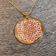 Flower of Life in 24 carat gold on 925 silver, rose mother of pearl and rose Sapphires sephiroth. mother of pearl background. Hallmarked Rose Gold Symbolic Necklace, Pink Gold Necklace With Polished Finish For Gift, Pink Engraved Necklace For Gift, Pink Medallion Jewelry As A Gift, Pink Medallion Jewelry Gift, Pink Medallion Jewelry For Gifts, Pink Medallion Necklace For Gifting, Pink Mother Of Pearl Necklace For Gift, Pink Engraved Round Necklace