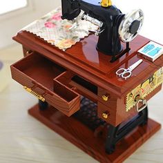 the sewing machine is sitting on top of a wooden stand with an american flag in front of it