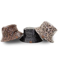 This reversible bucket hat features waterproof leopard print on one side and a soft stylish canvas on the other. It is reversible and a perfect piece to match your activity or outfit for the day. Just roll it up and toss in your bag to take this trendy bucket hat with you. Product Features: Reversible Solid or Leopard Pattern UVA/UVB Sun Protection Lightweight Durable Material Great for any Outdoor Activity or Fashionable Event Waterproof Material Foldable for Easy Travel Authentic CC Branding a Casual Black Waterproof Bucket Hat, Trendy Black Reversible Bucket Hat, Trendy Reversible Outdoor Hats, Leopard Bucket Hat, Bucket Hat Fashion, Kids Mittens, Kids Bucket Hat, Branded Caps, Reversible Bucket Hat