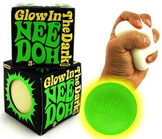 a hand holding a green and white ball in front of a box with the word glow in the dark on it