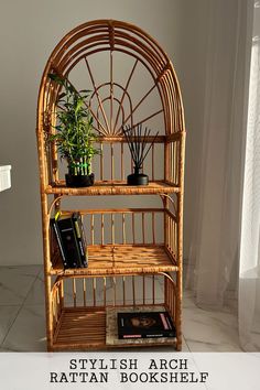 a rattan shelf with plants and books on it