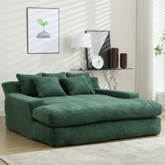 a living room with a large green couch