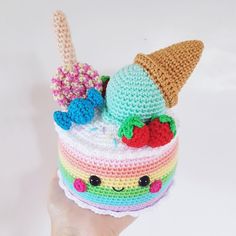 there is a crocheted cake with ice cream and strawberries on top that has been made to look like an ice cream sundae