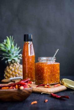 pineapple jam in jars with spoons next to it