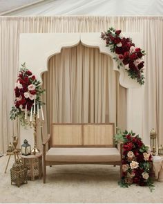 a decorated stage with flowers and candles