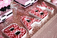 some pink and white candy in the shape of letters