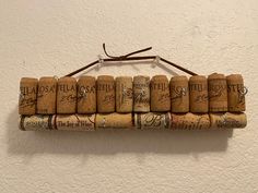 a bunch of wine corks hanging on a wall