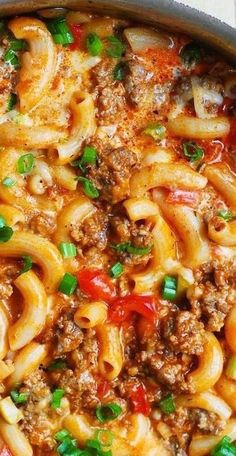 a pan filled with pasta and meat sauce