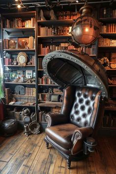 an old chair in front of a bookshelf filled with lots of books and other items