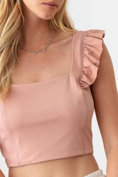 Add trendiness and femininity to your wardrobe with our Ruffled Cap Sleeve Square Neck Crop Top. Featuring delicate ruffled cap sleeves, a flattering square neckline, and a cropped length, this top exudes a charming and romantic vibe. Easily styled for various occasions, elevate your outfit game with its sweet and chic design. Features: Ruffled, Ruched Sheer: Opaque Stretch: No stretch Material composition: 75% nylon, 25% spandex Imported Pink Ruffle Top, Ruffled Crop Top, Top Les, Scarf Poncho, Ruffle Shorts, Neck Crop Top, 8th Grade, Bohemian Clothes, Square Necklines