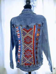 Thank you for visiting our Etsy Shop!  This listing is for a beautiful medium Aztec Embroidery Blue Denim Jean Jacket with studded detailing - Vintage Collection - Made in India.  Classic Denim jean jacket with chest pockets and button closure 97% cotton and 3% Lycra Dry Clean Only.  Jacket appears to be unused.  Perfect for a unique southwestern style denim jacket. Approximate Dimensions Are -  Length - 21" Bust - 36" Our vintage and retro items have been hunted down with passion for treasures Bohemian Denim Outerwear With Multicolor Embroidery, Embroidered Denim Outerwear For Festival, Bohemian Embroidered Denim Blue Outerwear, Bohemian Embroidered Denim Outerwear, Bohemian Denim Blue Embroidered Outerwear, Bohemian Embroidered Outerwear In Medium Wash, Bohemian Embroidered Blue Denim Jacket, Bohemian Blue Embroidered Denim Jacket, Bohemian Embellished Denim Jacket For Fall