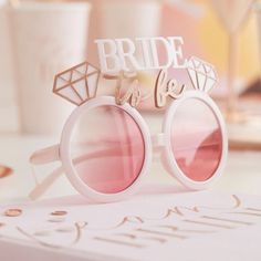 a pair of sunglasses with the words bride to be written on them