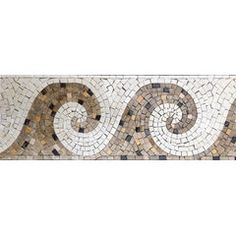 a white and brown tile border with swirls on the bottom, in different colors