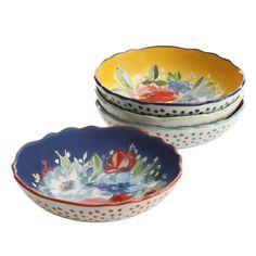 three bowls with flowers painted on them