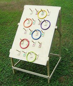 a white board sitting on top of a grass covered field