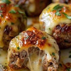 cheese stuffed meatballs on a white plate