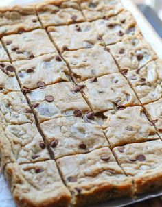 chocolate chip cookie bars cut into squares on top of each other, ready to be eaten