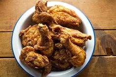 fried chicken in a bowl on a wooden table