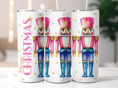 three cans with nutcrackers painted on them