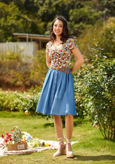 Covered throughout in our exclusive, hand-drawn Berry Blooms print atop a contrasting black background, this vintage-inspired knit top is such a unique floral find for your spring and summer styling. Made from a stretchy knit, this fitted top features short sleeves and a square neckline with stylish shirred detailing at the bust for a retro-chic finish. 48% Cotton, 48% Rayon, 4% Spandex Fabric provides stretch. Shirred bust. Fits true to size. Machine wash cold, lay flat to dry. Imported.﻿ | Mod Trendy Tops For Spring Garden Party, Trendy Tops For Summer Garden Party, Chic Retro Print Tops For Summer, Casual Retro Print Top For Spring, Vintage Summer Tops For Garden Party, Vintage Tops For Garden Party In Summer, Summer Styling, Retro Tops, Fitted Top