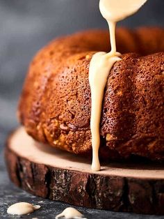 a bundt cake is being drizzled with icing