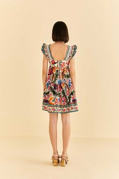 We just can't get enough of the Off-White Tropical Yard Sleeveless Mini Dress. This refreshing one-piece features ruffled shoulders and a flowy skirt, giving you an easy-breezy silhouette. Its flowerful print brings Brazil's nature elements to give your moments a tropical twist. Enhance the look with artisanal accessories, and get ready to bloom all season long. Sleeveless; Ruffle detailing on shoulders; Square neckline; Invisible zipper at side seam. Composition 100% COTTON Care Instructions HAND WASH SEPARATELY, DO NOT BLEACH, DO NOT TUMBLE DRY, LINE DRYING, IRON AT LOW HEAT, DO NOT DRY CLEAN Size and Fit Inches XXS XS S M L XL Bust 31 3/4 33 1/4 34 1/4 35 1/4 36 3/4 38 1/4 Waist 26 1/2 28 29 30 31 1/2 33 Length 32 3/4 33 1/4 33 3/4 34 1/4 34 3/4 35 1/4 Hip 49 1/2 51 52 53 54 1/2 56 Bohemian Summer Dresses With Ruffled Straps, Sleeveless Ruffle Dress For Garden Party In Summer, Summer Ruffle Dress With Smocked Back And Flutter Sleeves, Vacation Sundress With Flutter Sleeves, Bohemian Sleeveless Ruffled Dress For Vacation, Summer Ruffle Dress With Flutter Sleeves For Vacation, Bohemian Sleeveless Dress With Ruffles For Vacation, Summer Beach Ruffle Dress With Flutter Sleeves, Summer Vacation Ruffle Dress With Ruffled Straps