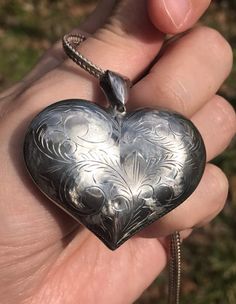 We are utterly charmed by this Vintage Sterling Silver Engraved Heart pendant. It has presence, elegance, and such lovely energy. What more dear present than a talisman that says "You have my heart" - and given the upcoming Mother's Day holiday, "Thank you for taking such tender care of mine." Rare for its' size and width, made in the 1980s. Chain not included in the listing, but included in the photographs so that you see the pendant closer to how it will look when a chain is added later to be Tender Care, Vintage Sterling Silver, Heart Pendant, My Heart, Jewelry Necklace Pendant, Mothers Day, Accessory Gift, Jewelry Necklaces, Electronic Accessories