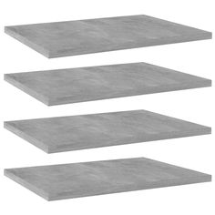 three grey concrete shelves on white background