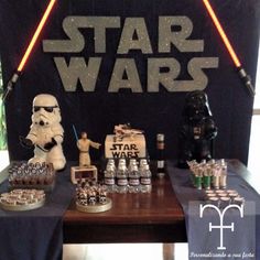 star wars themed dessert table with darth vader, stormtrooper and more