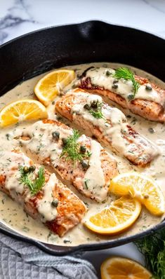 salmon with lemon sauce in a cast iron skillet