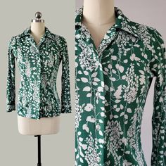 1970's shirt by Alfred Dunner in a lovely green with white floral and leaf silhouette print.   Features pointed collar, button closure and button cuffs.  The fabric is a soft polyester.  A super groovy addition to your wearable vintage collection.     Excellent vintage condition: no tears, holes, stains, fading or repairs.   Hand washed, hung dry and steamed by me, ready to wear.  Approximately a size small, pictured on a size 4 mannequin and there is some wige room. There is some stretch to the Green Collared Top With Floral Print, Vintage Green Collared Top, Fitted Green Tops With Retro Print, Retro Green Printed Blouse, Fitted Green Top With Retro Print, Retro Green Button-up Blouse, Green Fitted Printed Shirt, Fitted Green Printed Shirt, Vintage Green Fitted Shirt