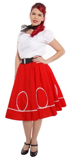 a woman wearing a red skirt with white circles on the bottom and black trim around her waist