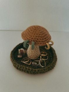 a crocheted hat with scissors and other items on it