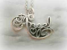 A gorgeous calligraphy charm writing Angel, with a small heart in the middle.It is so elegant cute and beautiful! **This listing is for a silver plated / gold plated angel charm with a rhodium plated or gold plated chain** ##IMPORTANT!##Please inform me at the checkout what item you want, and what size you wish your chain to be. I have 16'' chains and 18'' chains AVAILABLE. Sterling silver charm and chain also available - Cost 25 dollars.Contact me for custom orders..:) Marshmallow Vodka, Gorgeous Calligraphy, Tiny Heart Necklace, Mini Necklace, Angel Necklace, Tiny Heart, Small Heart, Dream Jewelry, Gold Plated Chains