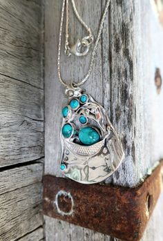 "From Porans collection ----> Unique Silver Multi Stone vintage Pendant with Turquoise Description length:45mm width:33mm The length of the chain is usually 18\"- 22\", yet can be made at any size you wish, if you are interested in a specific length, Please! write a note on check out This is a unique design by Porans Handcrafted jewelry inspired by the depth of the see beauty Wrapped as ready to be given as a special gift for your beloved ones Comes in a beautiful jewelry gift box. We can als Oval Silver Necklace With Large Pendant, Silver Necklace With Large Oval Pendant, Silver Necklace With Stone Setting, Silver Oval Pendant Jewelry With Stones, Silver Jewelry With Oval Pendant Stones, Bohemian Silver Turquoise Oval Pendant Necklace, Bohemian Silver Necklace With Large Stone, Artisan Pendant Necklace In Antique Silver, Sterling Silver Teardrop Pendant Necklace With Stones