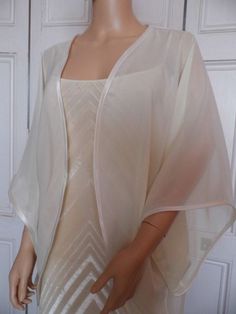 This is a beautiful hand made chiffon kimono ideal as a cover-up for weddings or special occasions. It has a satin edging It can be made in any size from 8 to 24 (UK sizes). It is made in the UK. It is normally sent out to you within 5 days, but I am very happy to make your order a priority if you need it urgently. Just let me know the date needed by. Postage is free in the UK! International postage is £9. I am happy to exchange items or refund your payment if you are less than happy with Organza Kimono, Chiffon Kimono Jacket, Chiffon Bolero, Gilet Kimono, Crochet Bolero Pattern, Bridal Kimono, Chiffon Jacket, Elegant Outfit Classy, Organza Sleeves