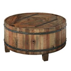 a round wooden table with metal straps on the top and bottom, made out of wood