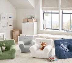 four children's chairs with stuffed animals on them in a white and green room