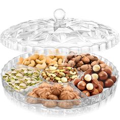 an assortment of nuts in a glass container