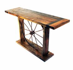 an old fashioned wooden table with wheels on it