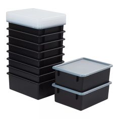 black and white storage containers stacked on top of each other