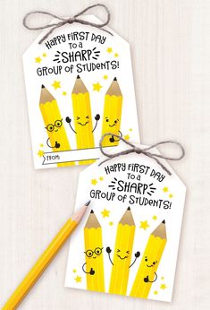 two yellow pencils with faces drawn on them and the words happy first day to share