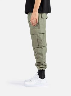 Urban Cargo Pants With Functional Pockets For Streetwear, Functional Streetwear Cargo Pants With Multiple Pockets, Functional Cargo Pants With Multiple Pockets For Streetwear, Functional Hiking Bottoms With Cargo Pockets, Khaki Combat Parachute Pants With Pockets, Nylon Techwear Pants With Multiple Pockets, Military Style Cargo Bottoms For Streetwear, Sporty Streetwear Cargo Pants With Patch Pockets, Urban Cargo Pants With Multiple Pockets