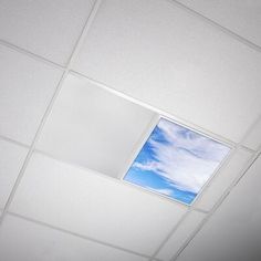 the ceiling is white and has a blue sky in it